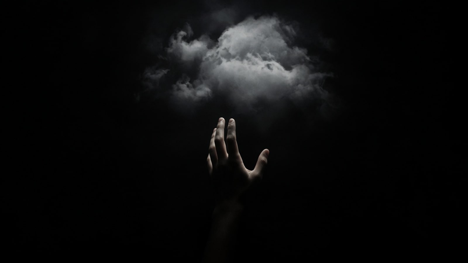 A hand reaching for the clouds
